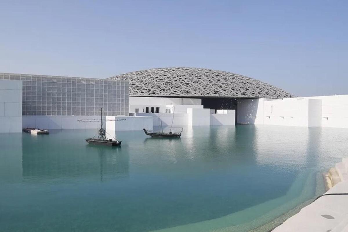 two boats in the water in front of a building