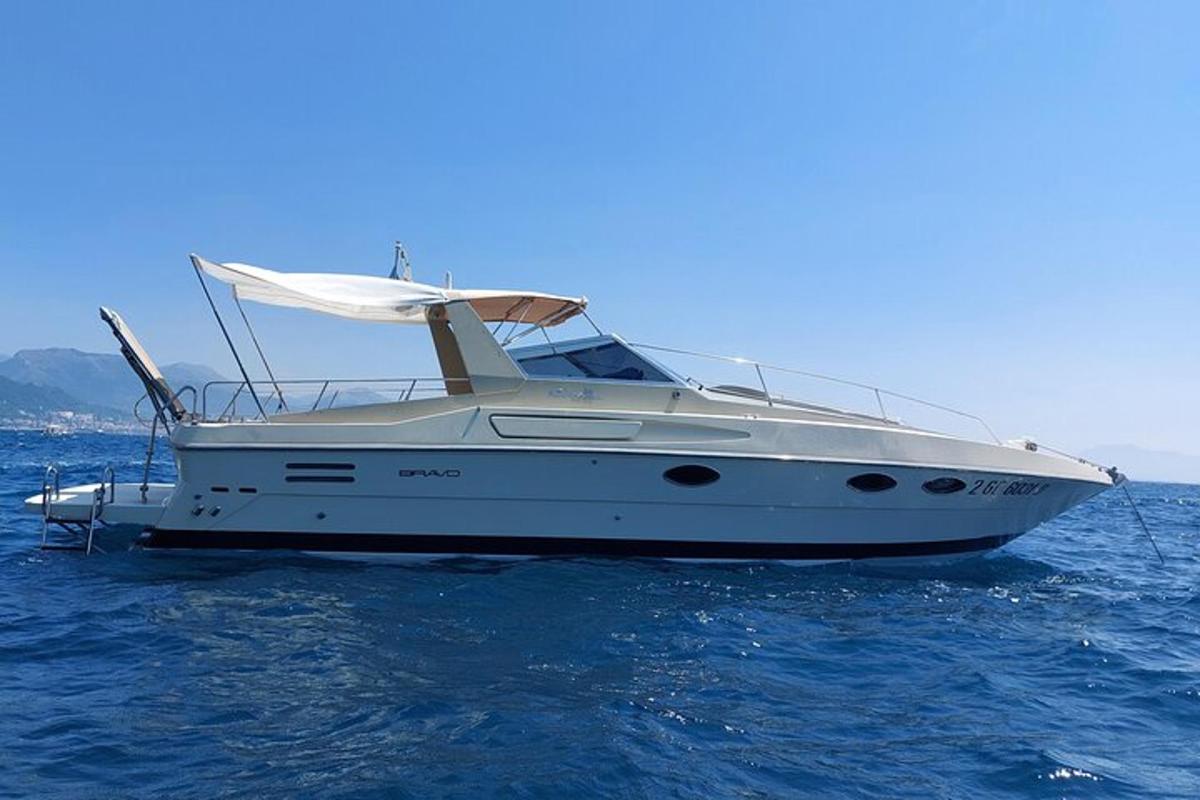 a white boat in the water on the ocean
