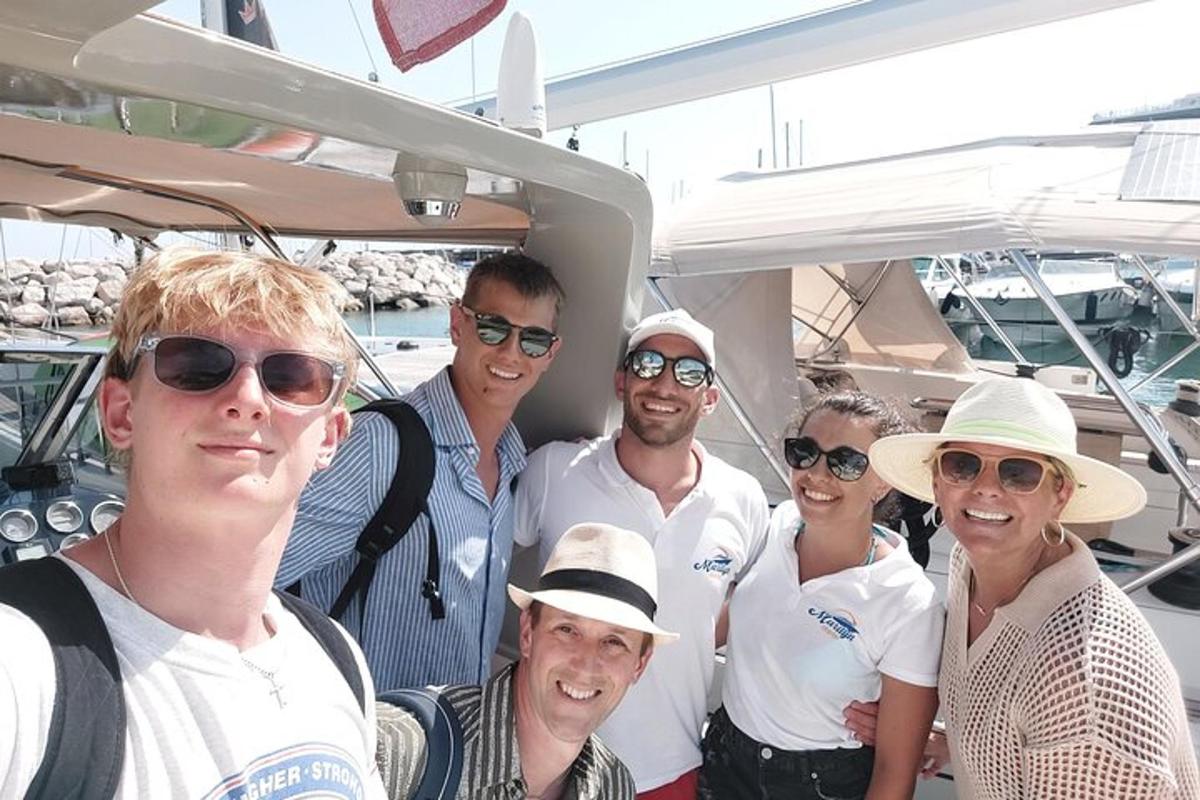 a group of people posing for a picture on a boat