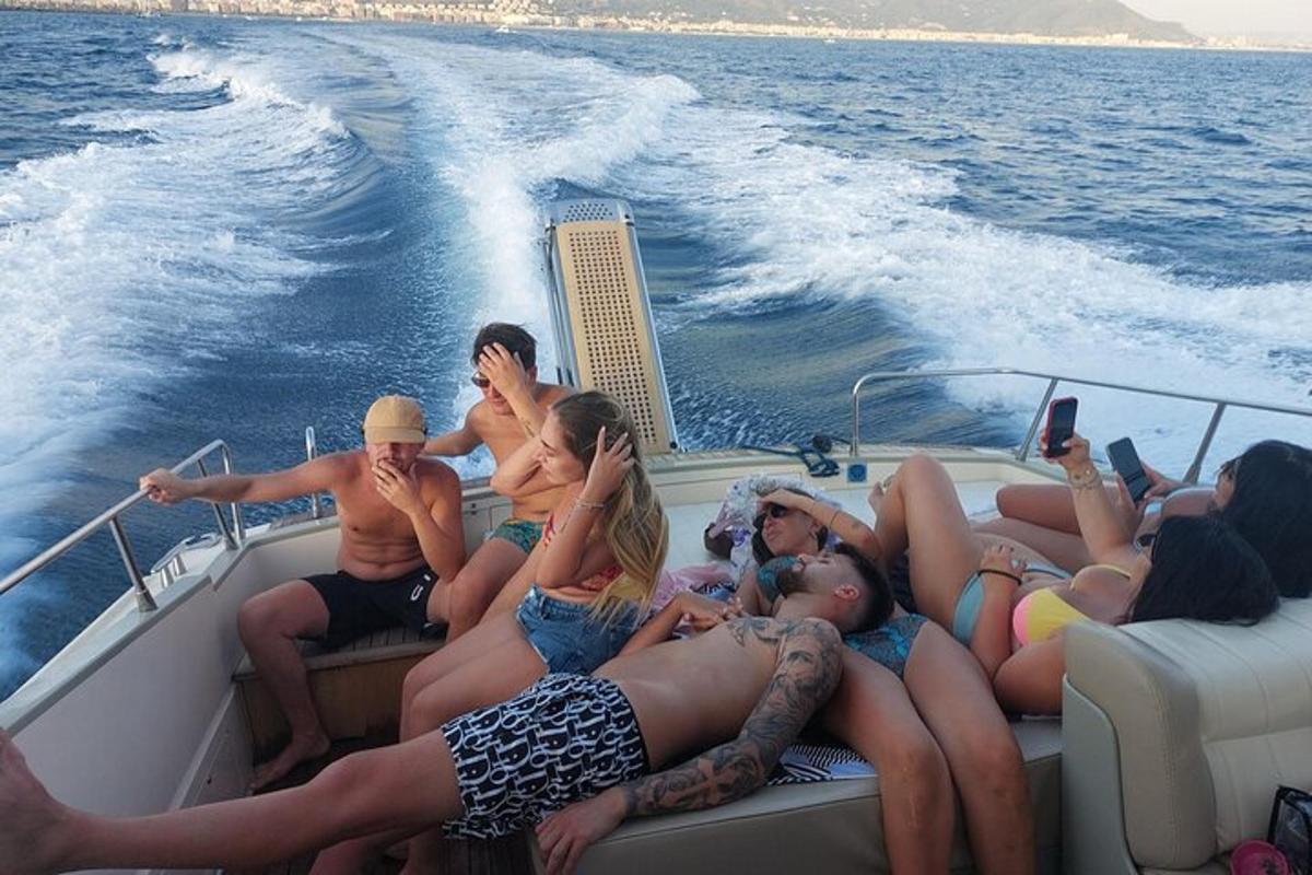 a group of people sitting on a boat