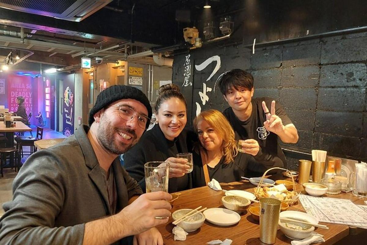 a group of people sitting at a table in a restaurant