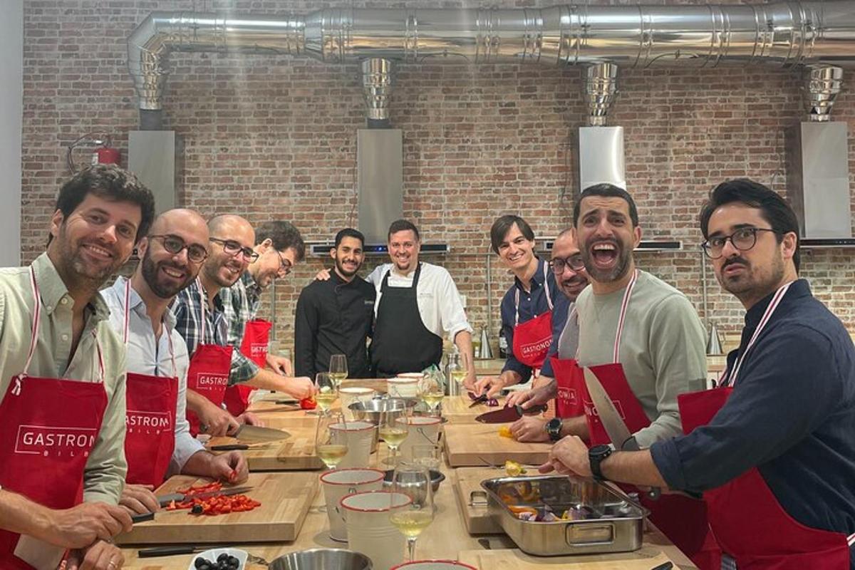 a group of people standing around a table in a kitchen