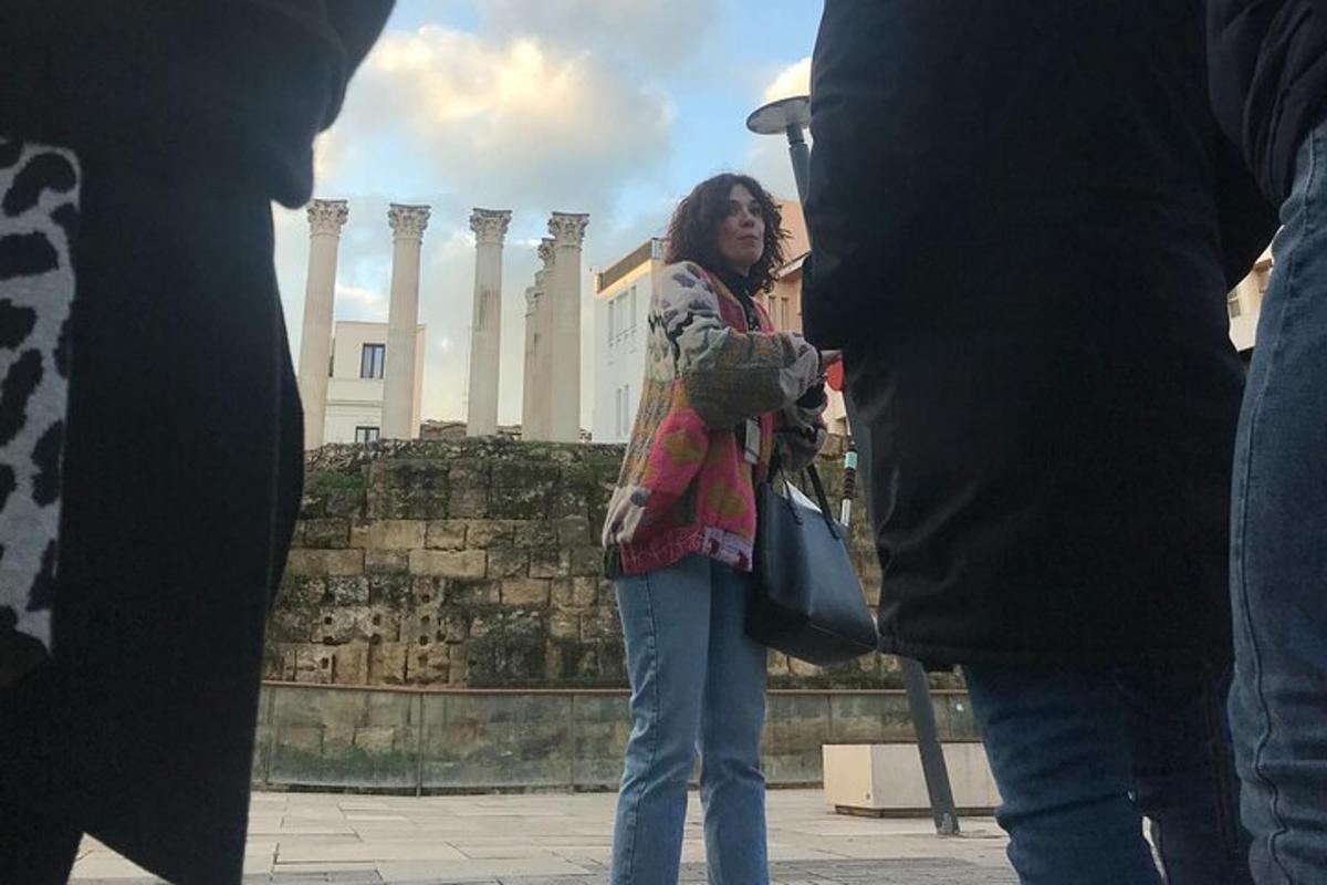 a woman standing in front of a building