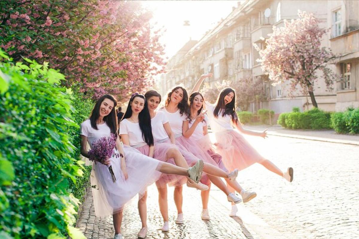 a group of girls in dresses are posing for a picture