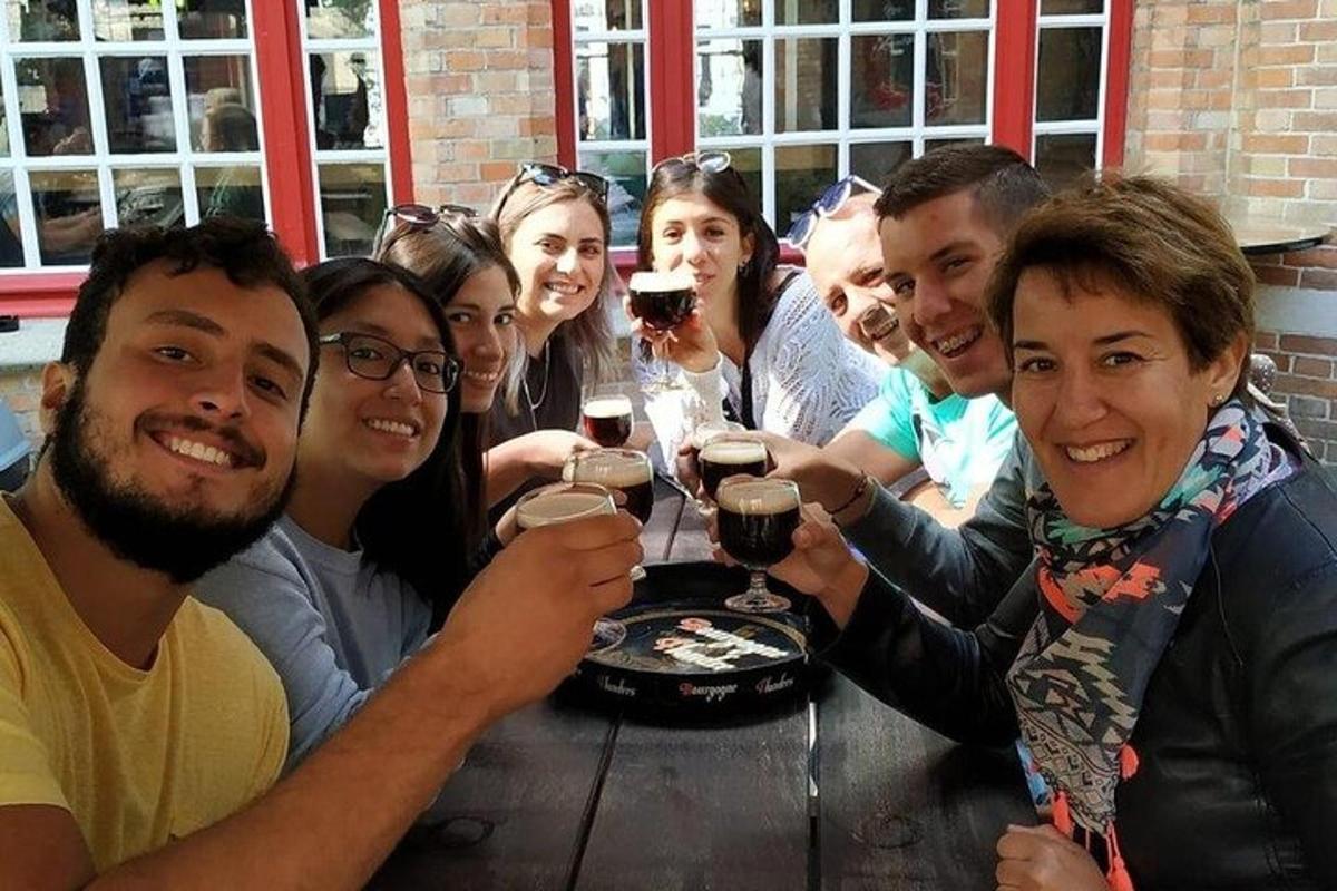 a group of people sitting around a table drinking wine