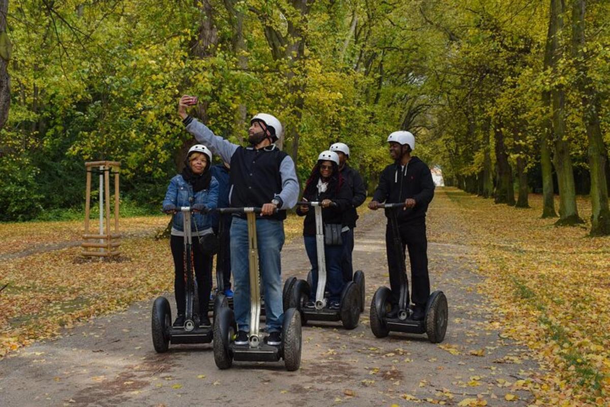 a group of people riding on segifts in a park
