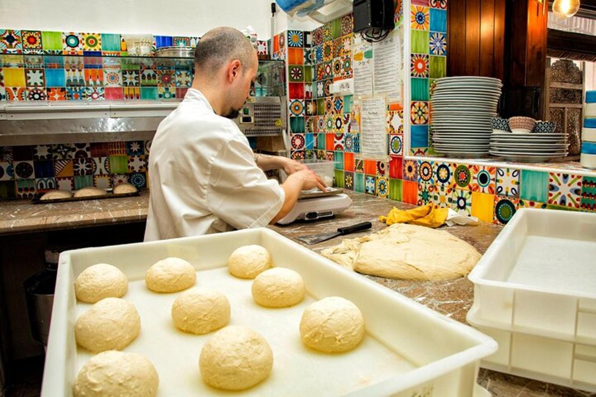 a baker is making bread in a kitchen