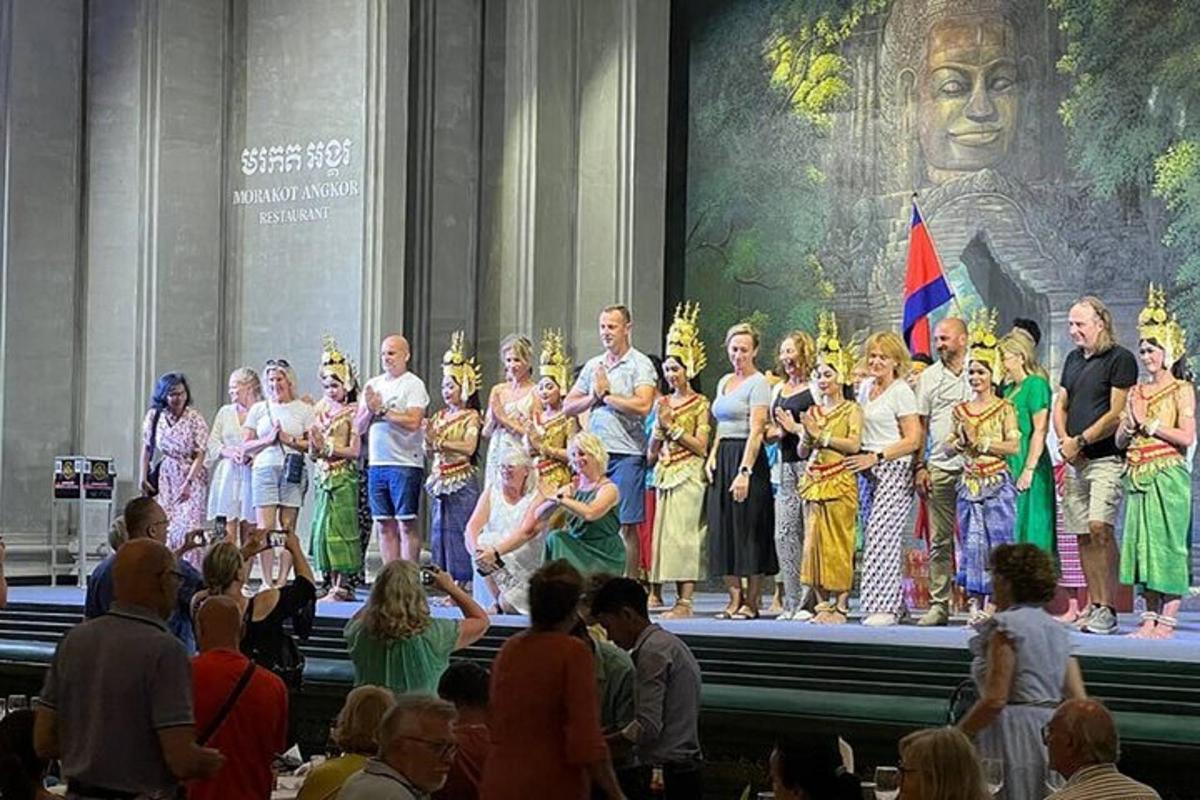 a group of people standing on a stage in front of a crowd