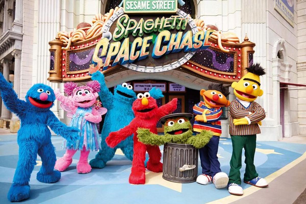 a group of stuffed animals standing in front of a ride