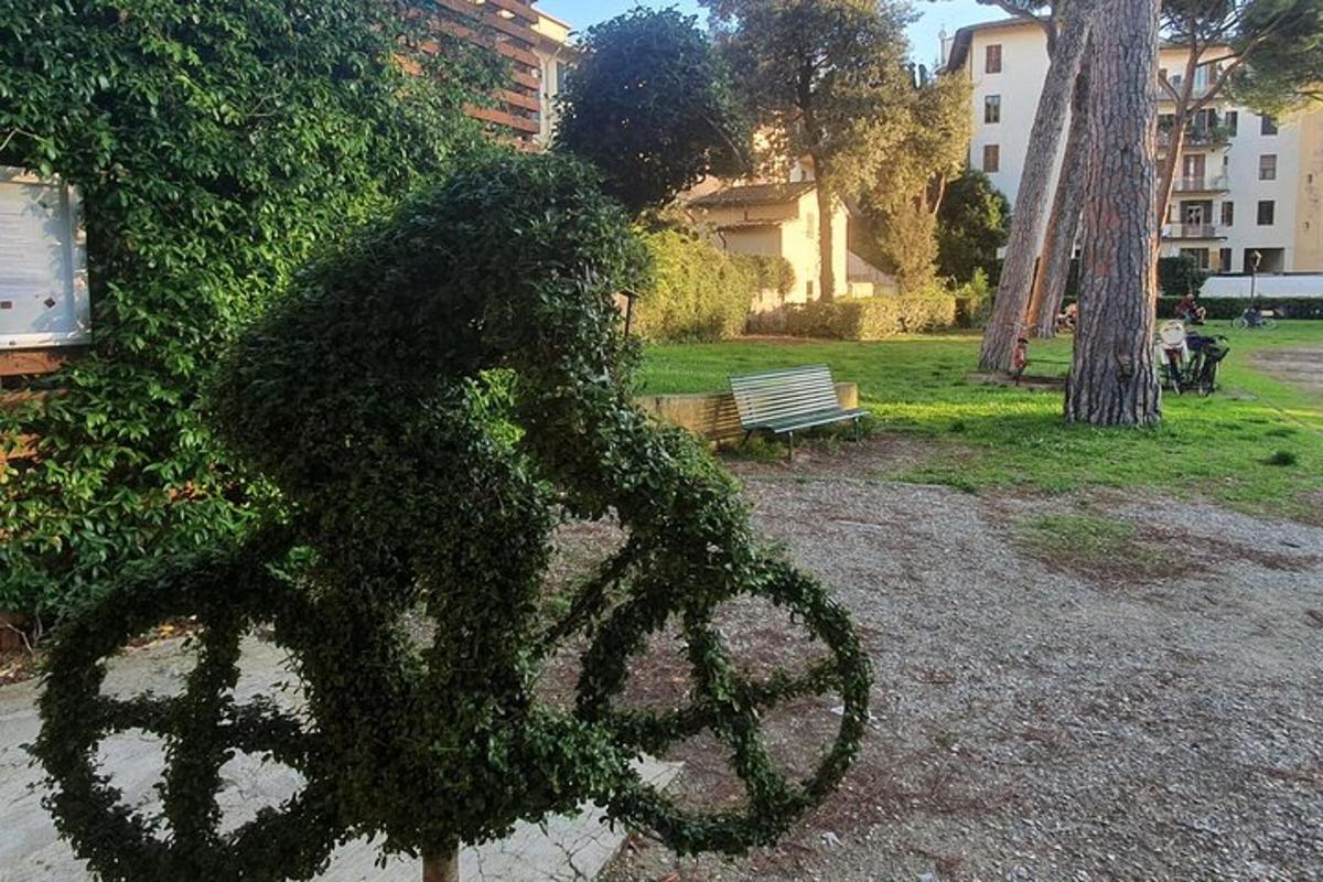 a statue of a person riding a bike