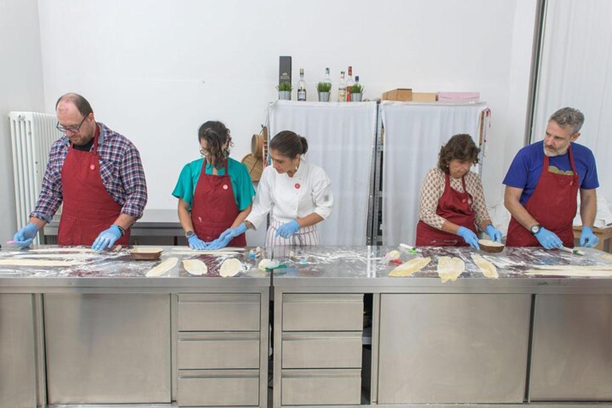 a group of people in a kitchen preparing food