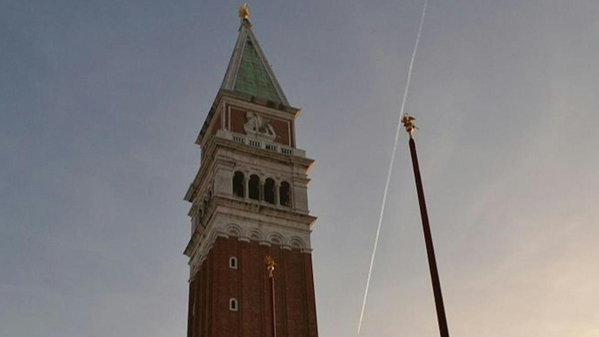 a tall tower with a steeple on top of a building