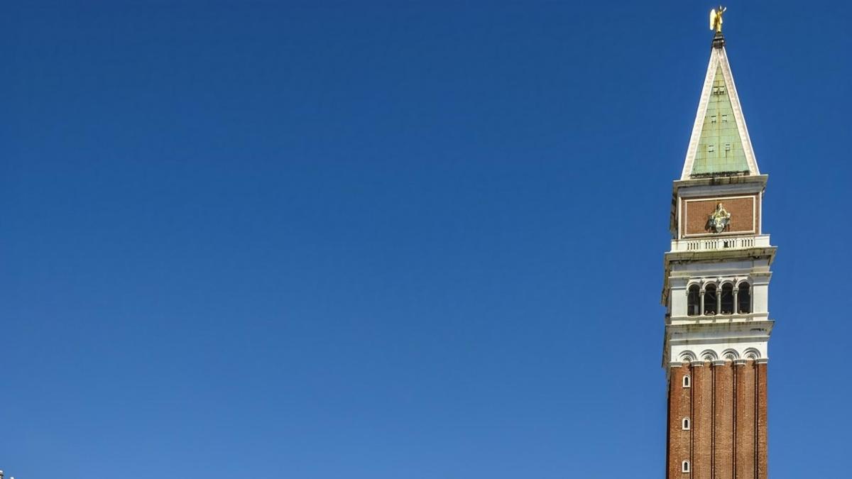 a clock tower with a steeple on top of it