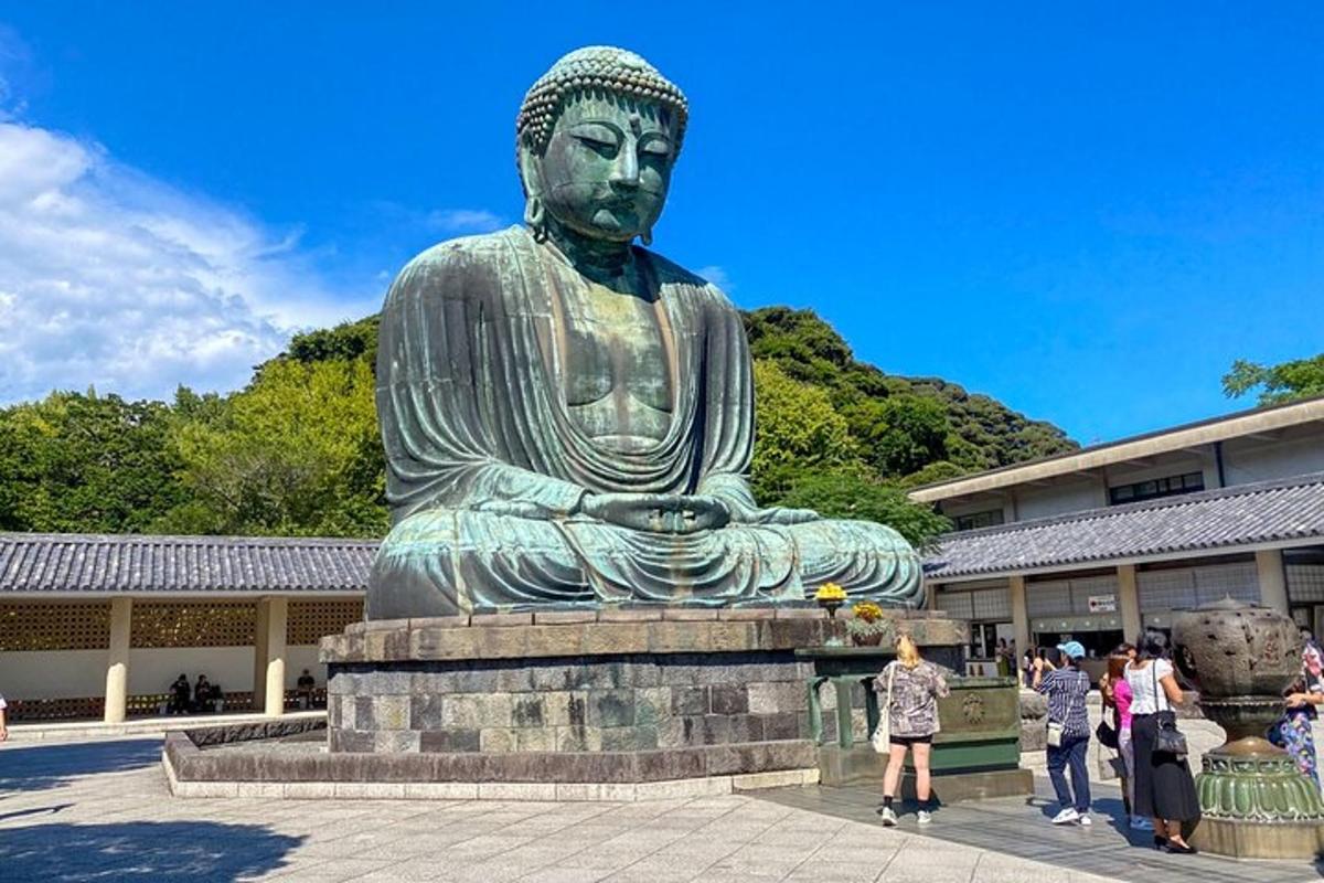 a statue of a buddha in front of a building