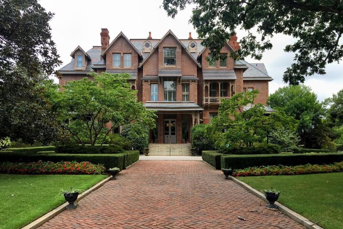 a large house with a brick walkway in front of it