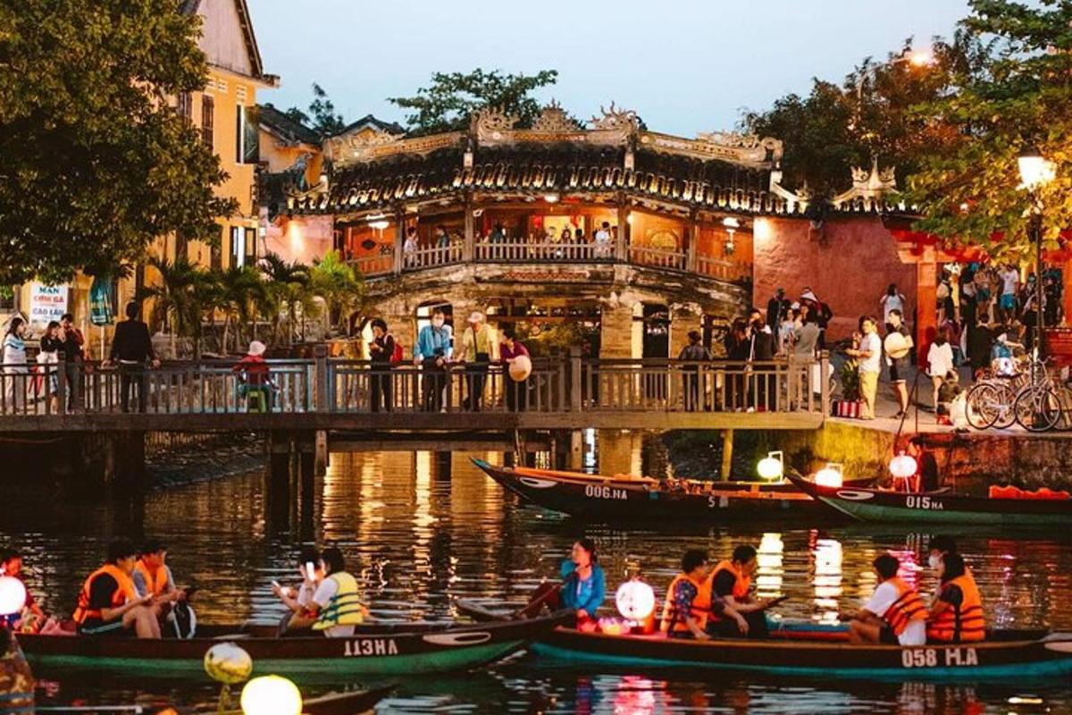 a group of people in gondolas in the water near a building