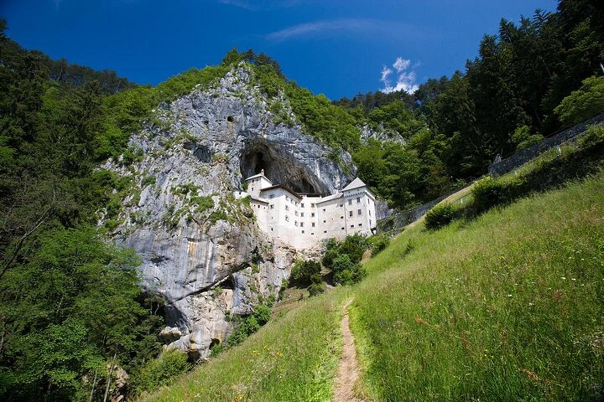 a building on the side of a rocky mountain