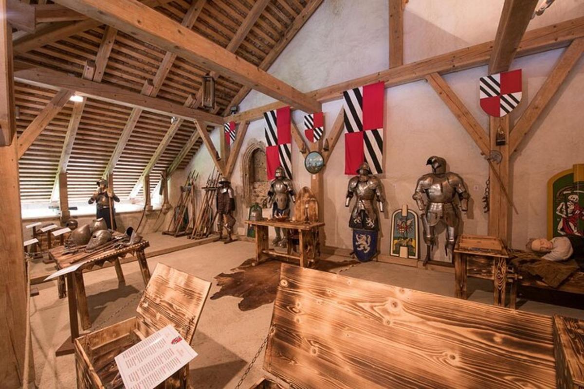 a room with armour on display in a museum