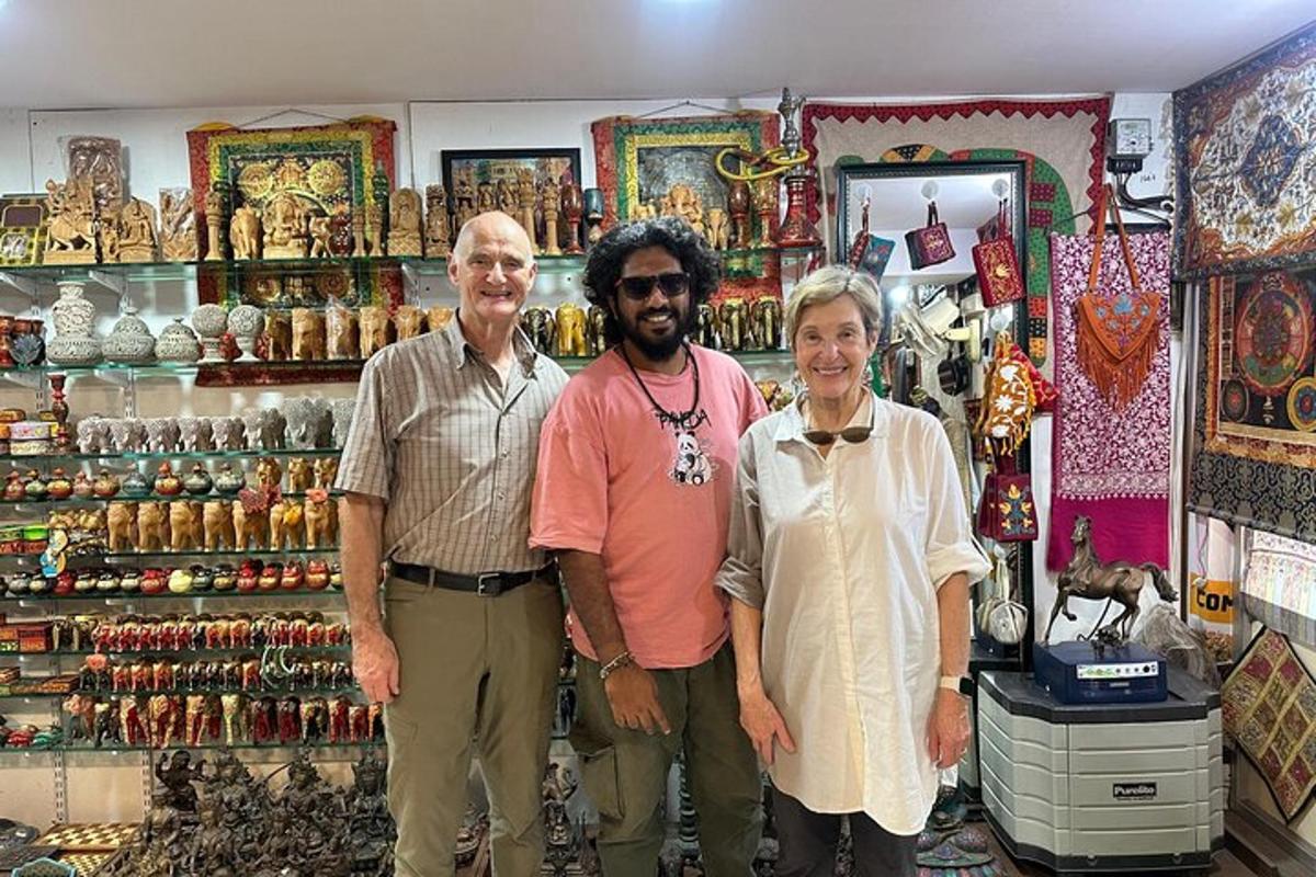 a group of three people standing in front of a shop