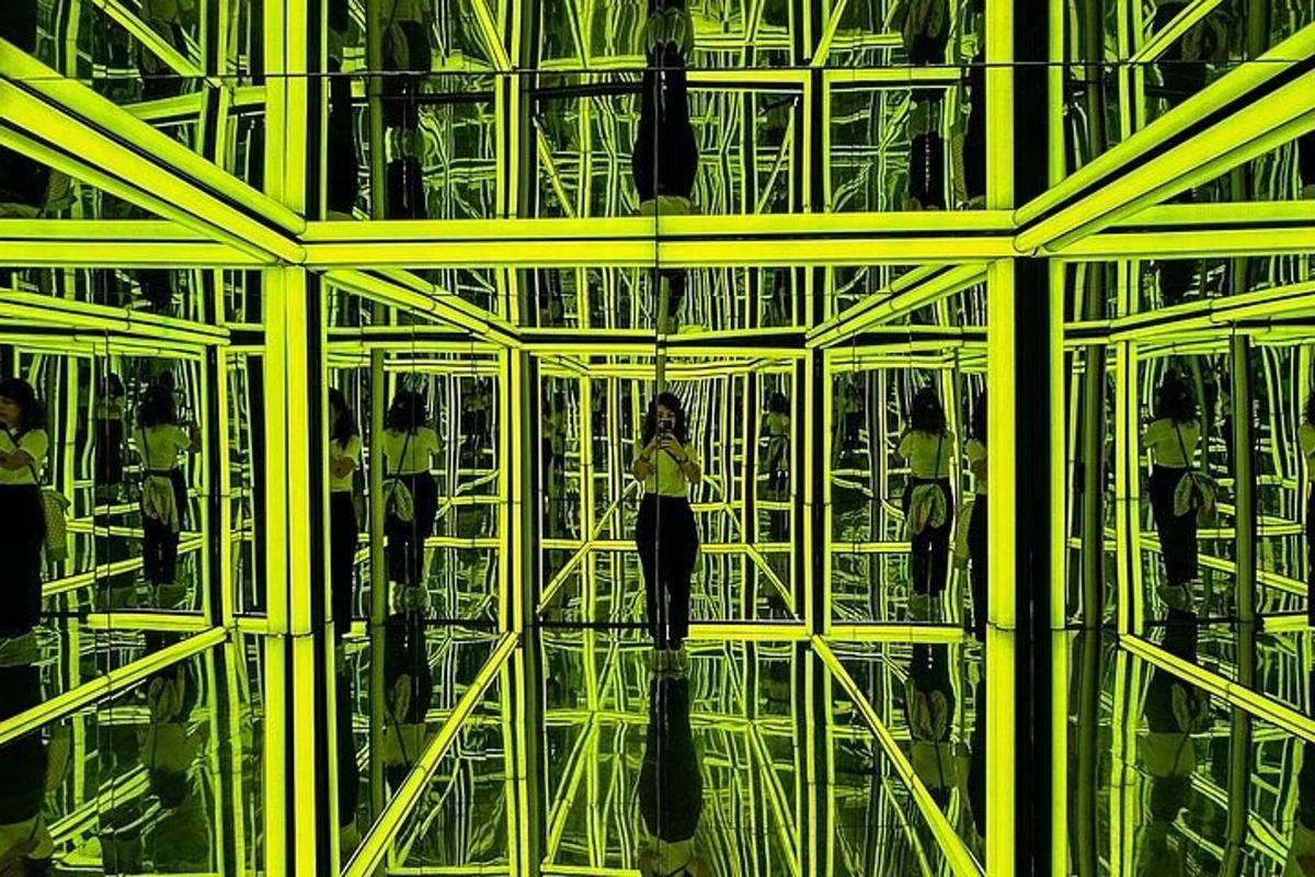 a woman is standing inside of a glass building