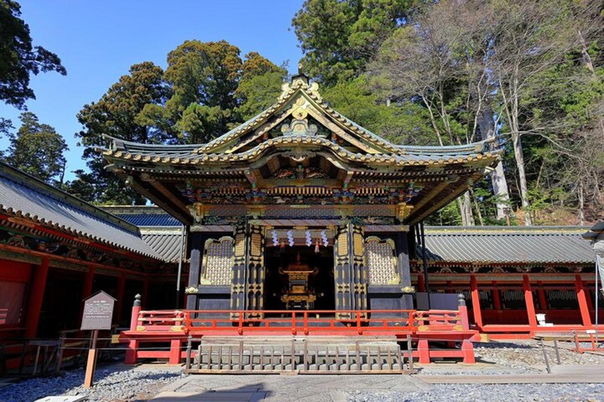 a large building with red benches in front of it