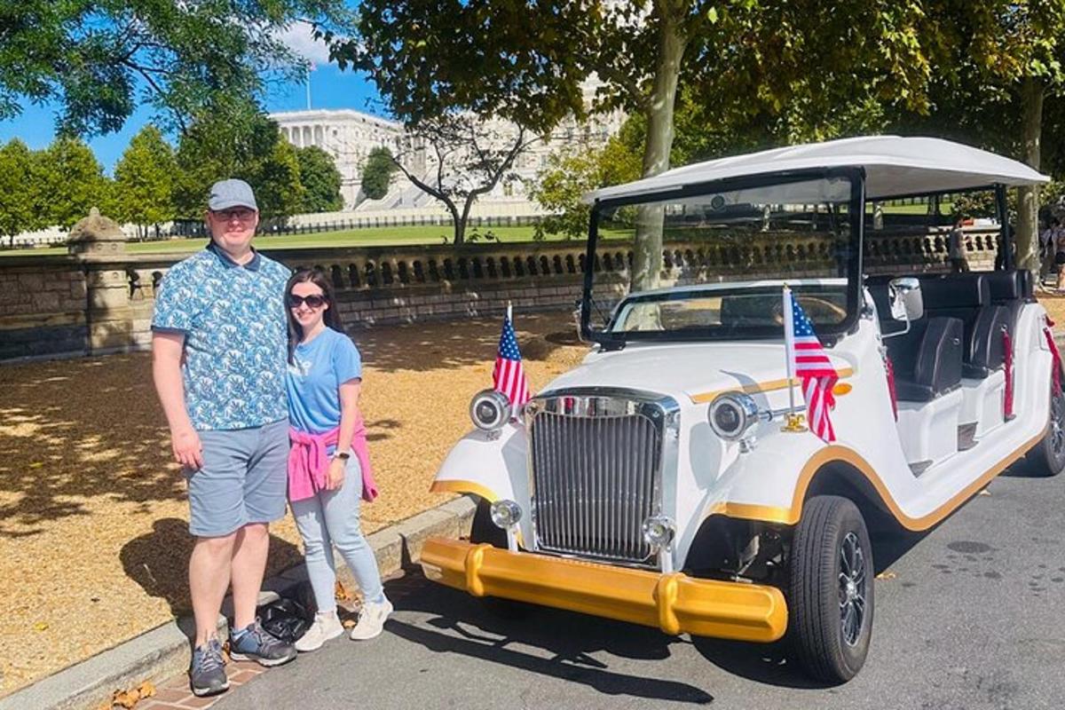 a man and a woman standing next to a limo