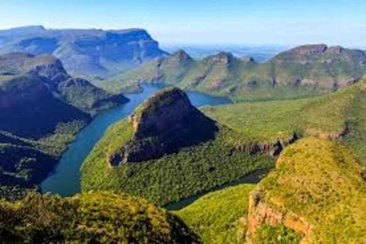a view of a river in the mountains