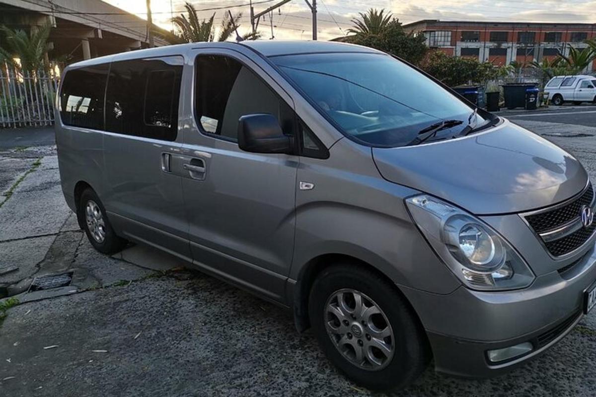 a silver van parked in a parking lot