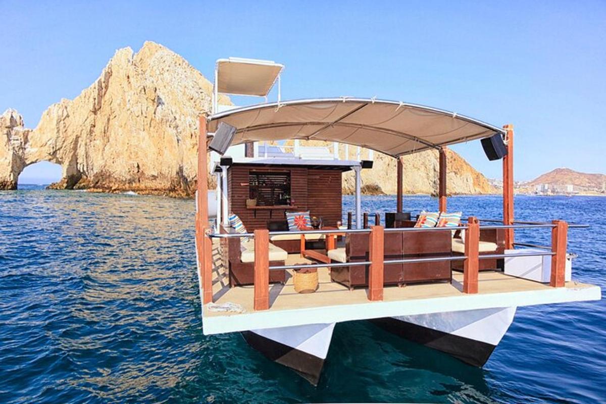 a small boat with a cabin on the water