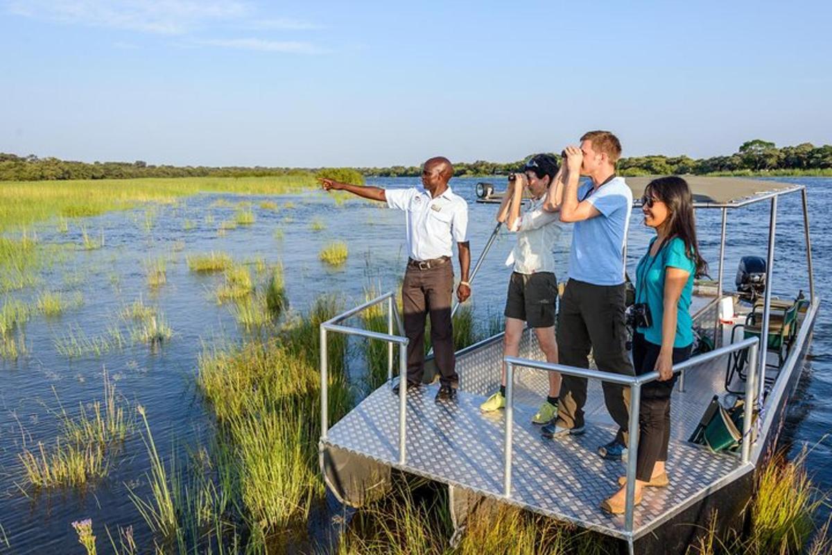 a group of people standing on a boat in the water