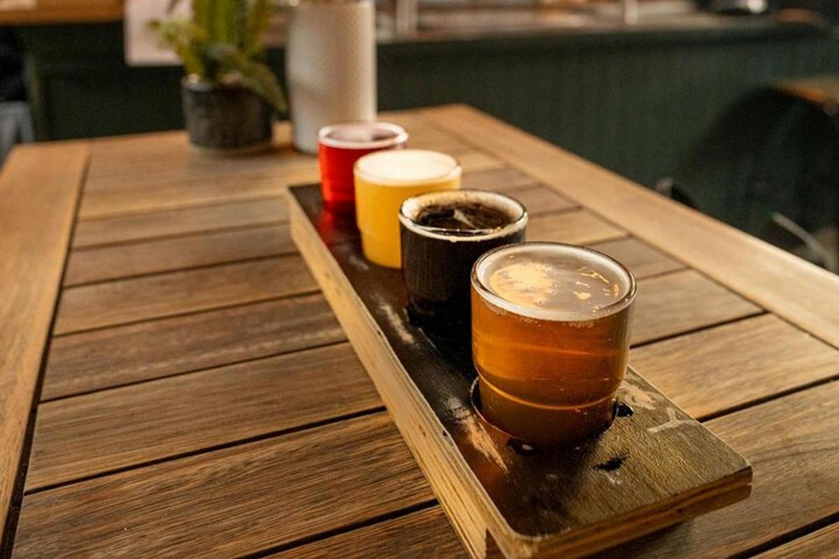 a wooden table with three different types of drinks on it