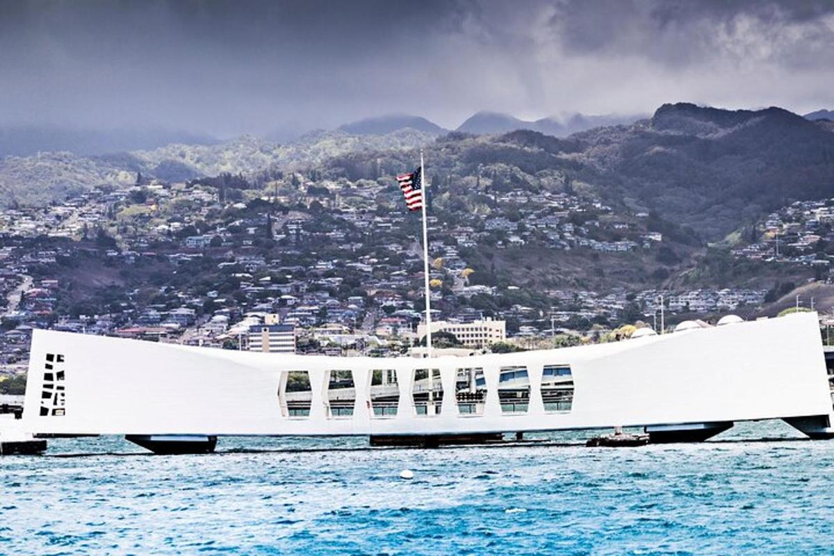 a large white boat in the water with a city