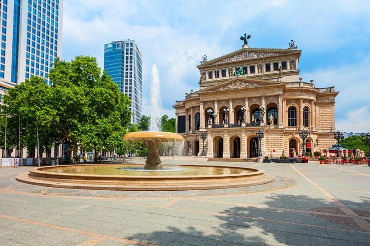a large building with a fountain in front of it