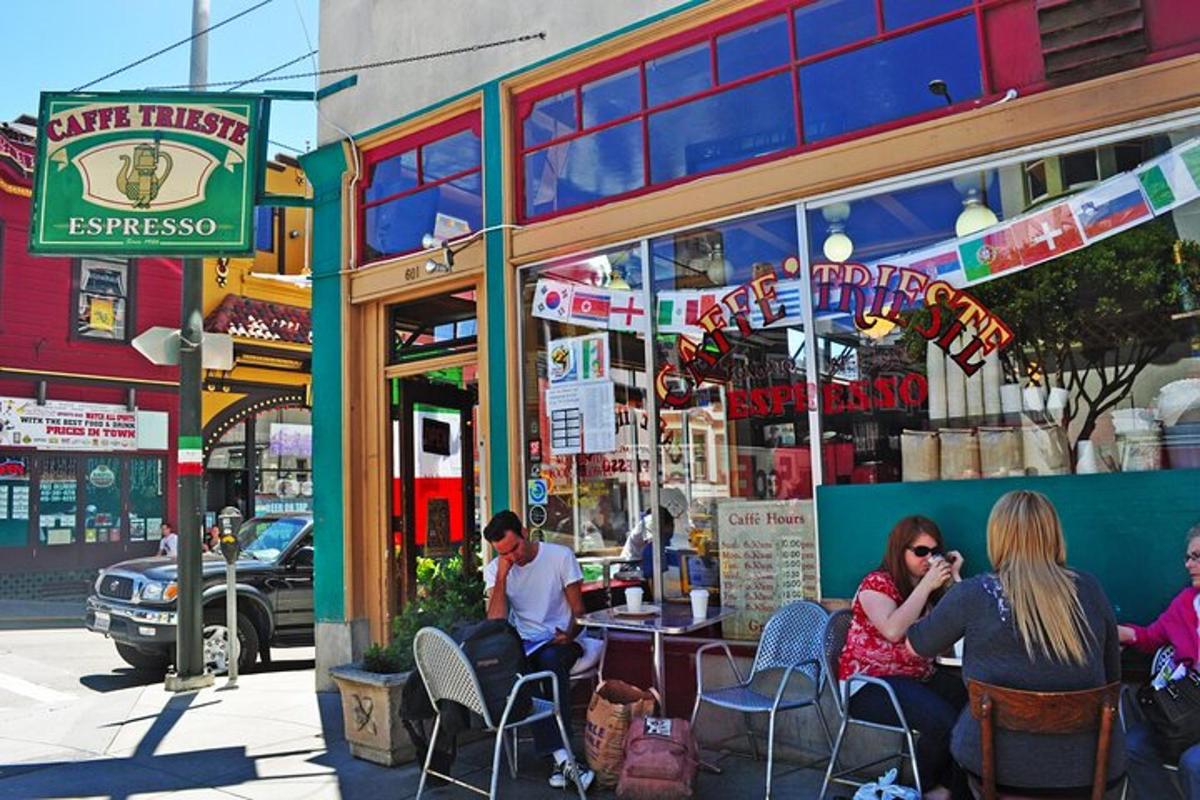 a group of people sitting outside of a restaurant