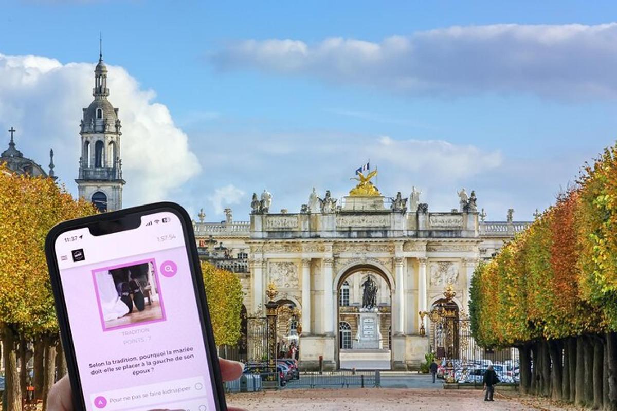 a person holding a cell phone in front of a building