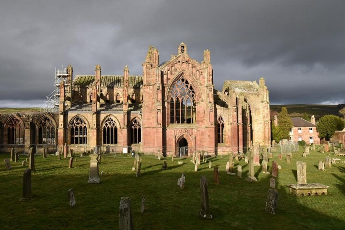 an old church with a bunch of graves in front of it