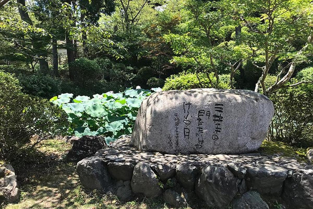 a stone monument sitting on top of a rock