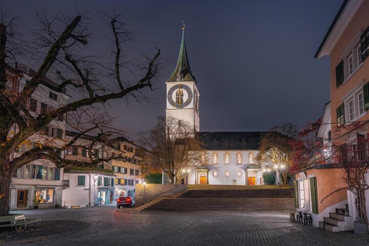 a large building with a clock tower at night