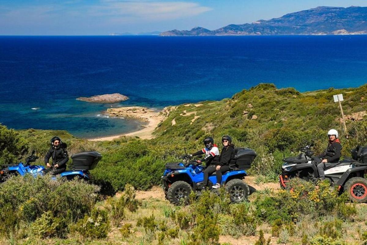 a group of people riding on atvs on a hill
