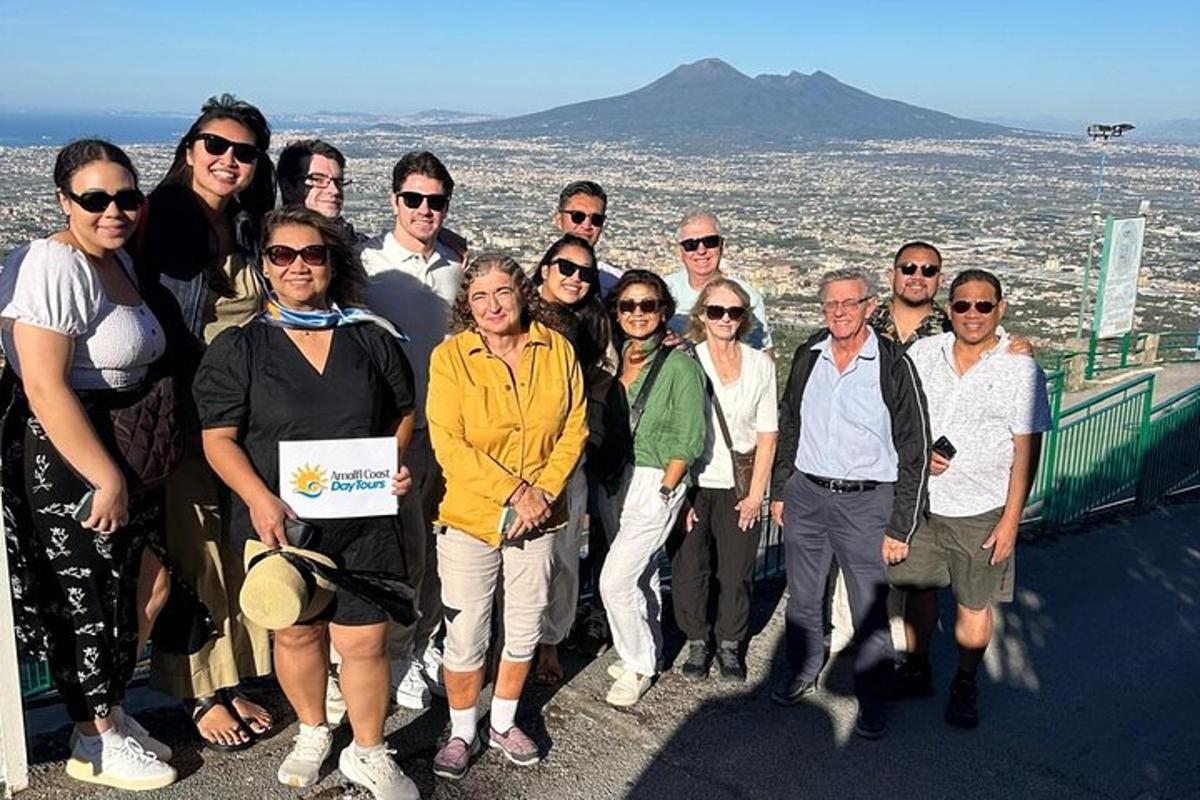 a group of people posing for a picture on the top of a building