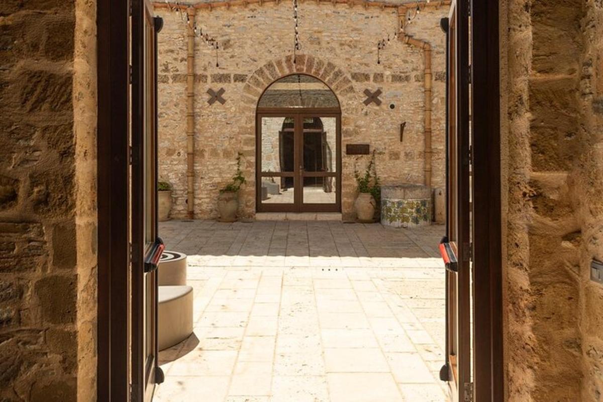 an open door to a building with a courtyard