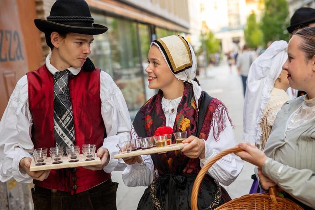 a group of people in traditional clothing holding food items