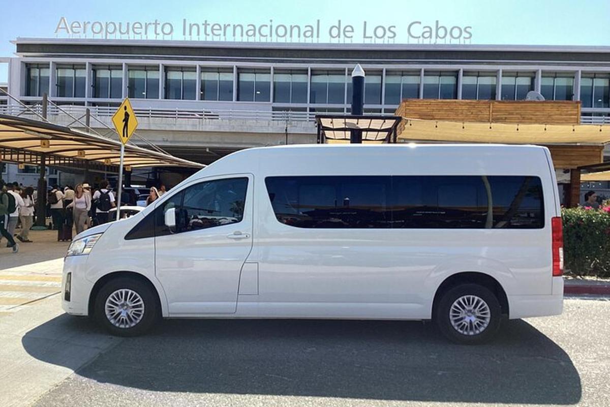 a white van parked in front of a building