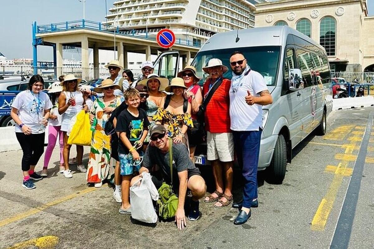 a group of people standing in front of a van