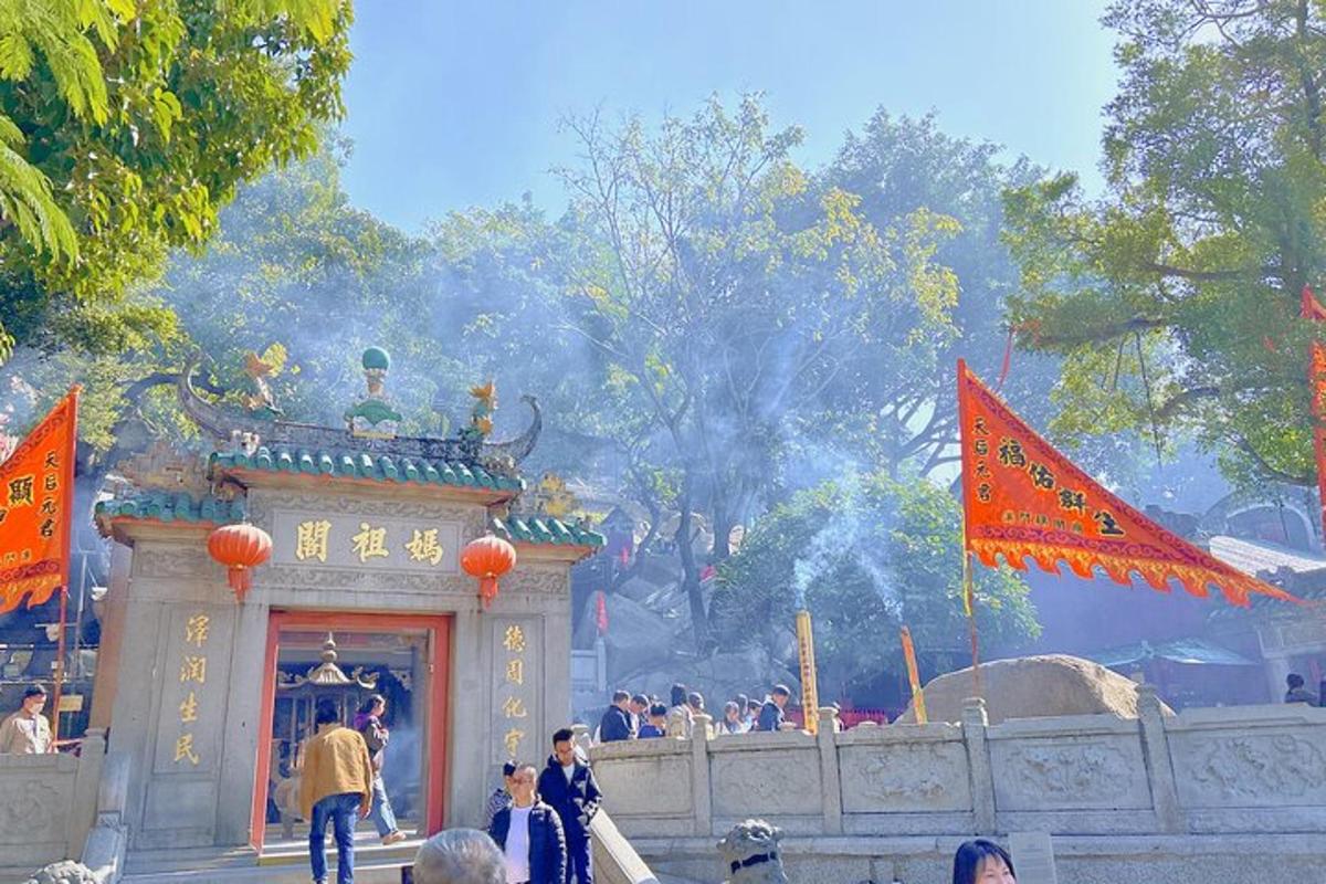 a group of people standing in front of a temple