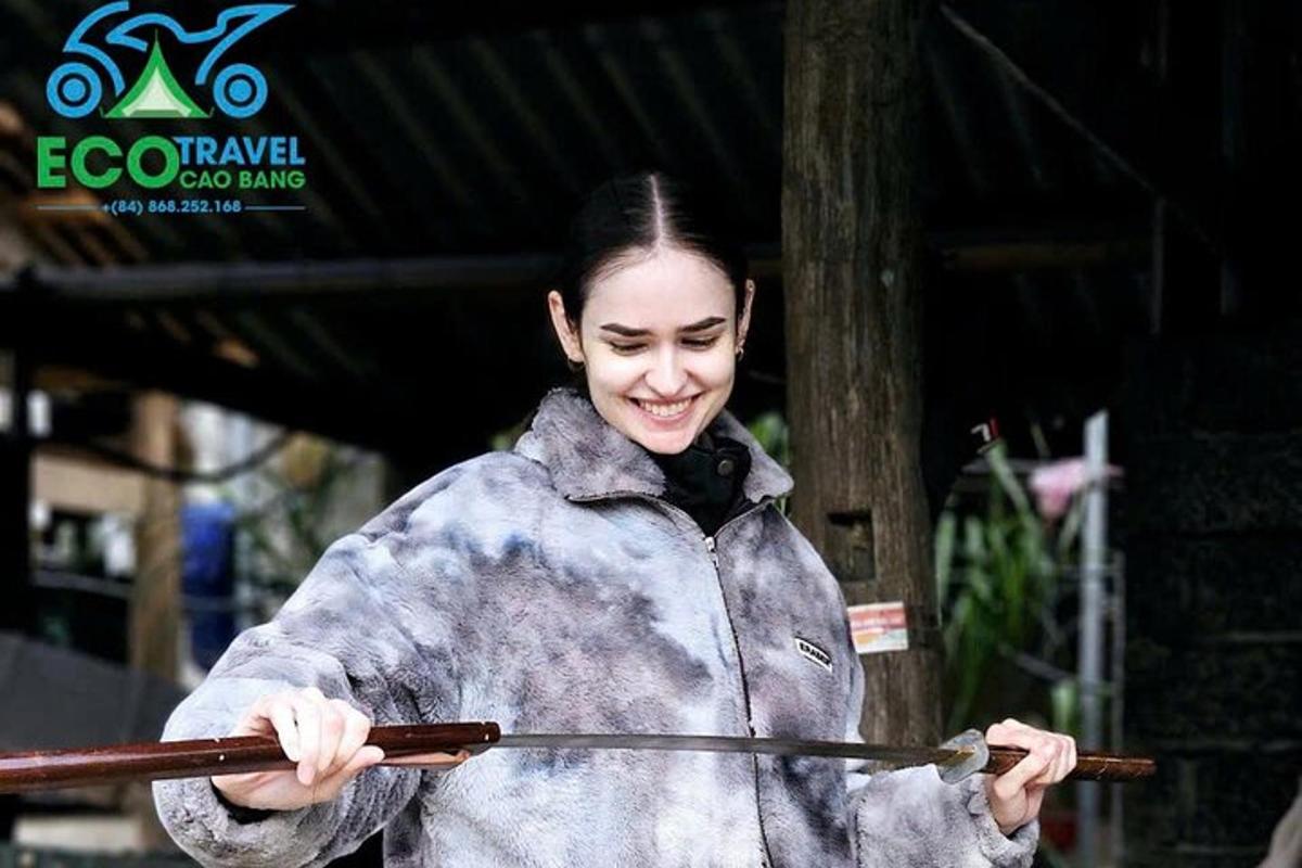 a woman is holding a stick in her hands