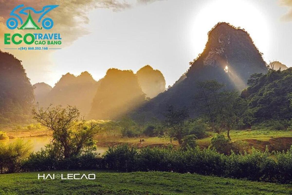 a picture of a valley with mountains and a river