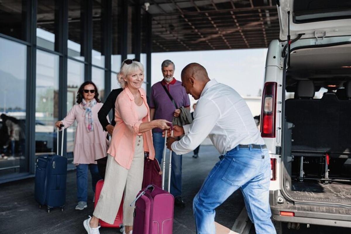 a group of people standing next to a truck
