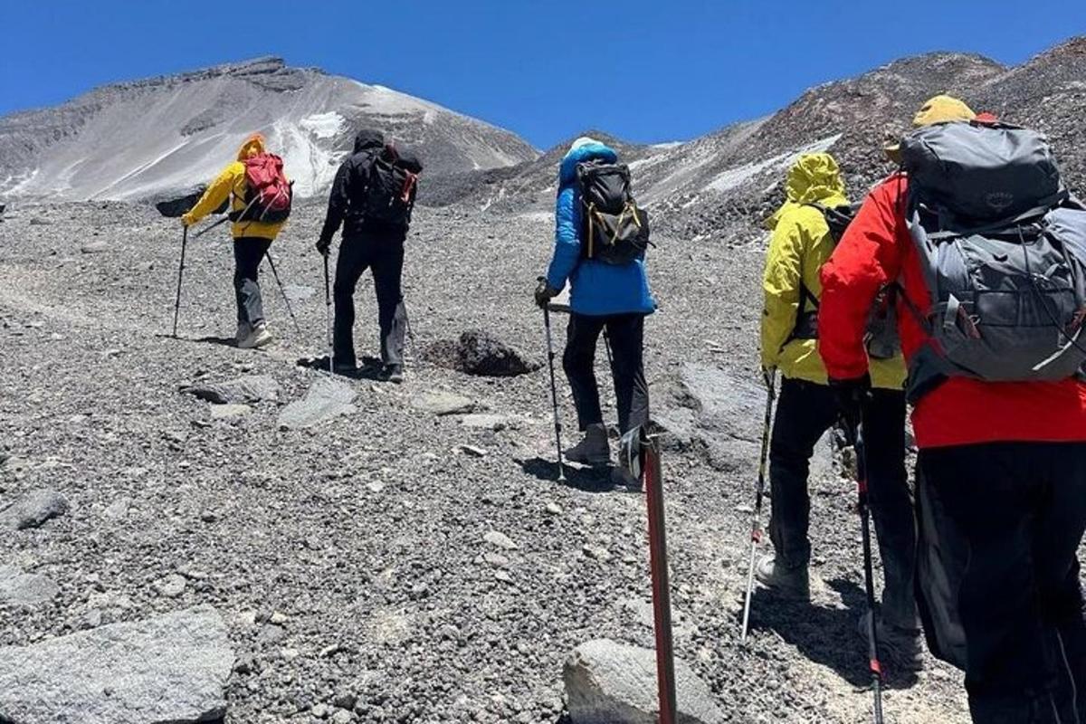a group of people hiking on a mountain
