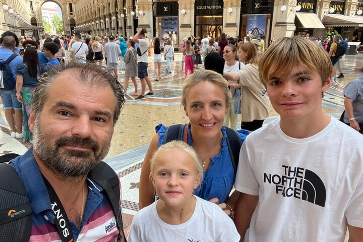 a family posing for a picture in a shopping mall